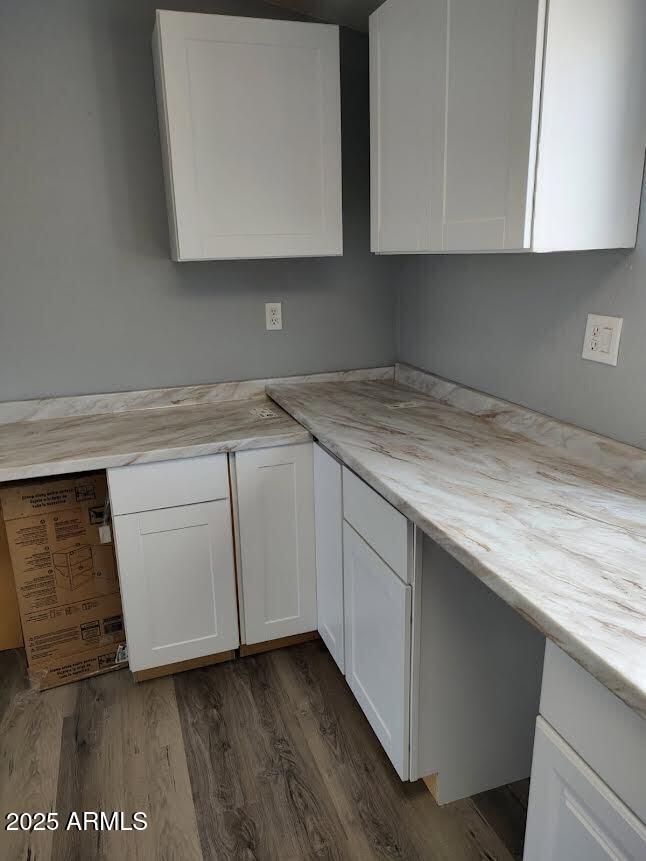 65623 Hall Street Salome, AZ 85348 - Photo 12 of 14 a kitchen with granite countertop white cabinets and a stove