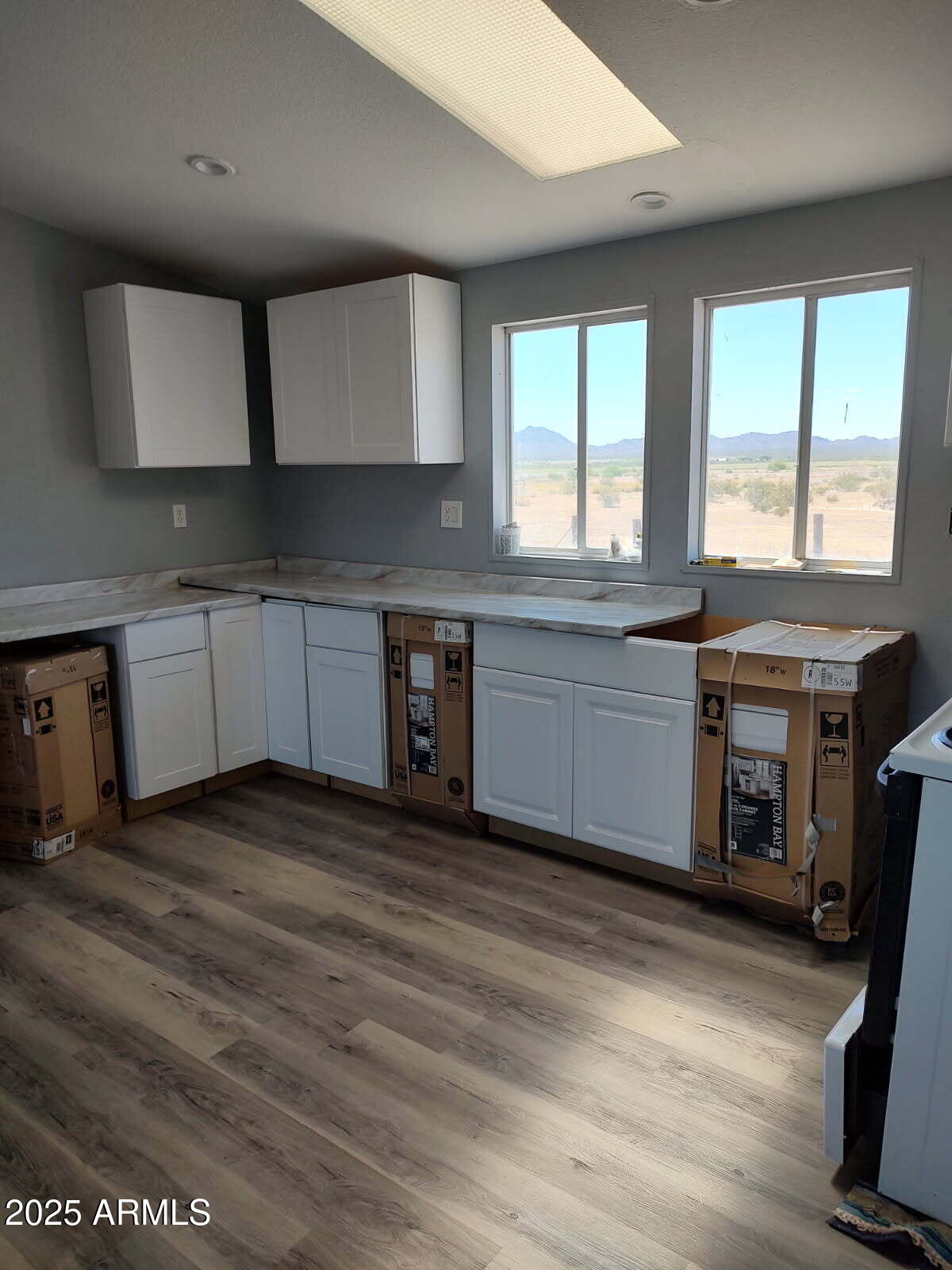 65623 Hall Street Salome, AZ 85348 - Photo 7 of 14 a kitchen with stainless steel appliances granite countertop a stove a sink and a microwave