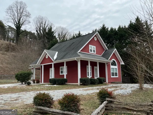 a front view of a house with yard