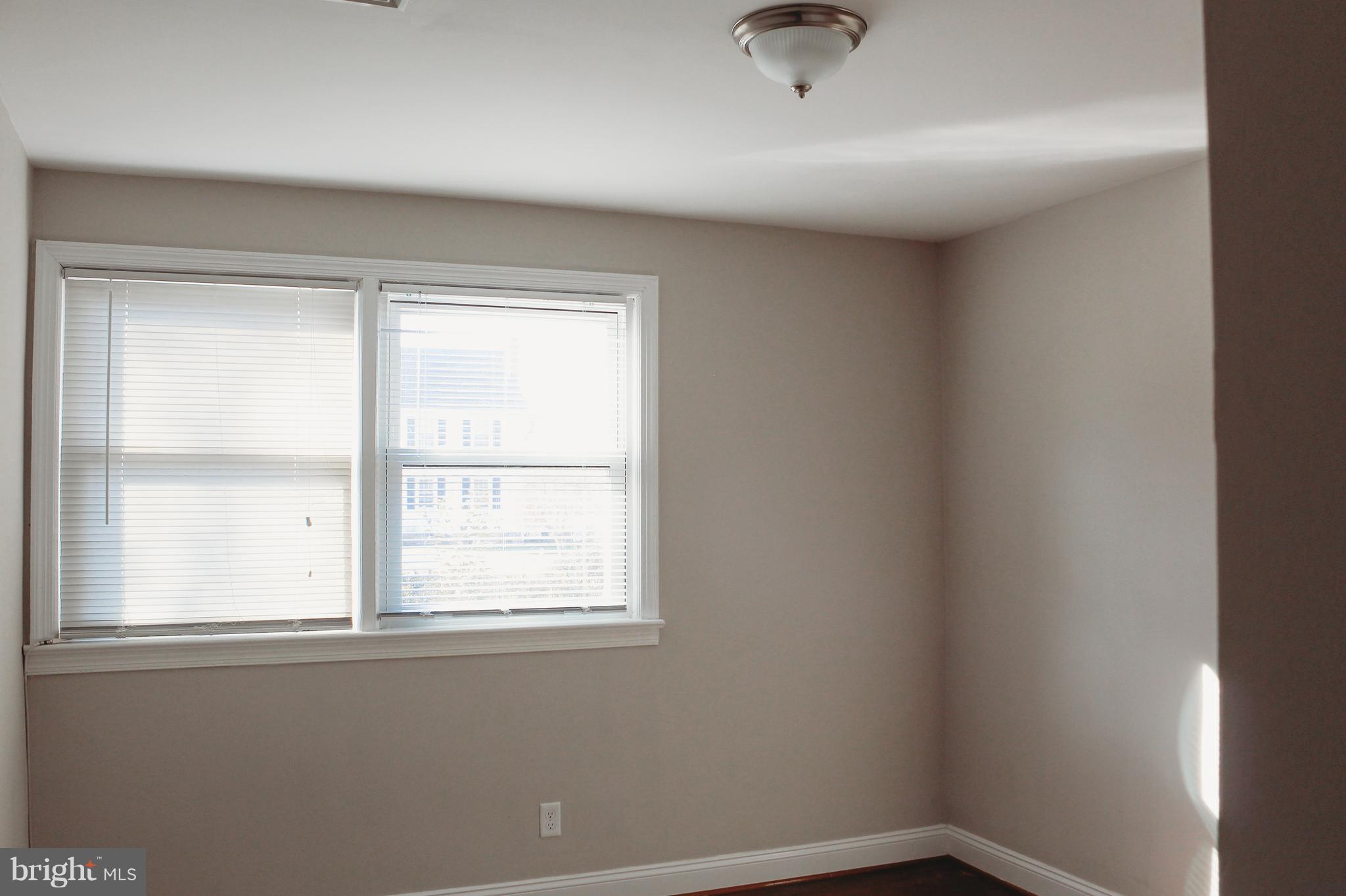 9101 Sudley Road Manassas, VA 20110 - Photo 12 of 19 an empty room with a window