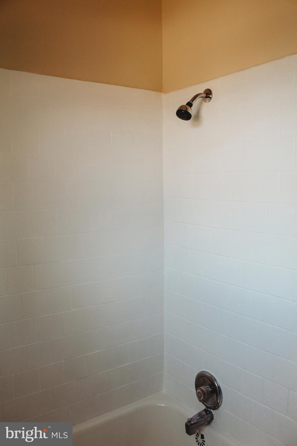 9101 Sudley Road Manassas, VA 20110 - Photo 17 of 19 a bathroom with a shower