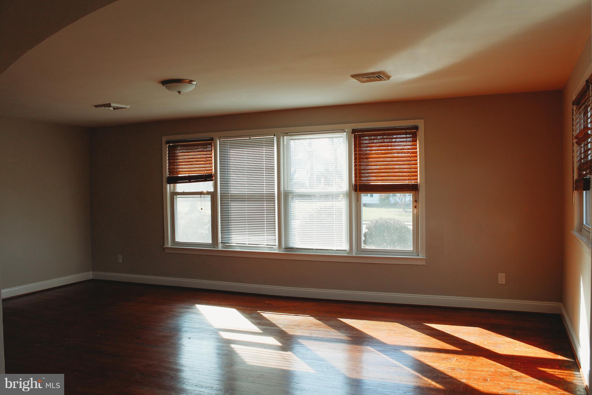 9101 Sudley Road Manassas, VA 20110 - Photo 7 of 19 a view of an empty room and window
