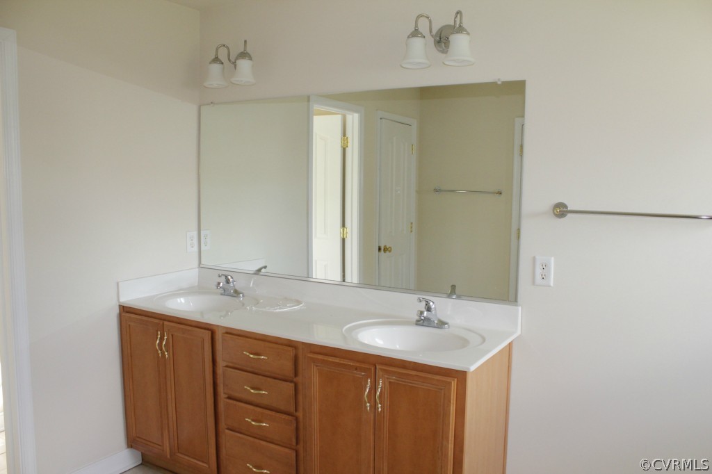 3308 Ceres Road Henrico, VA 23294 - Photo 15 of 18 a bathroom with a sink and a mirror