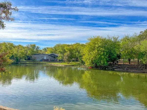 a view of a lake with a big yard
