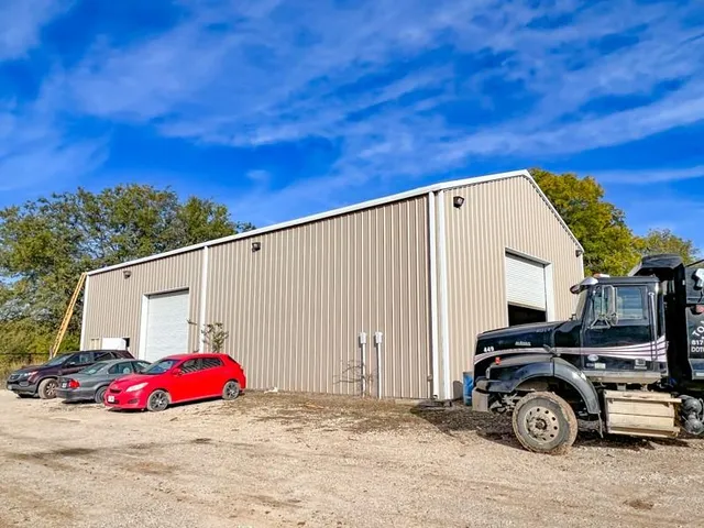 a view of a patio with couches and a fire pit