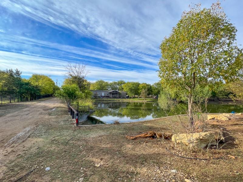 14205 Old Denton Road Roanoke, TX 76262 - Photo 20 of 29 a view of a lake with a yard