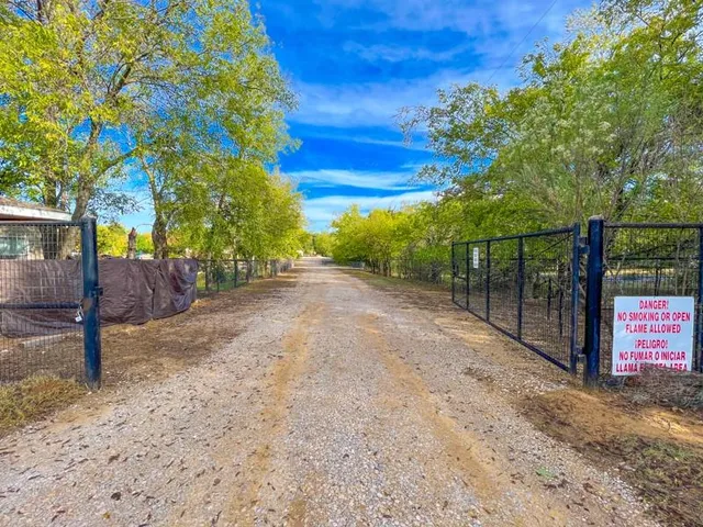 a view of a street with an trees