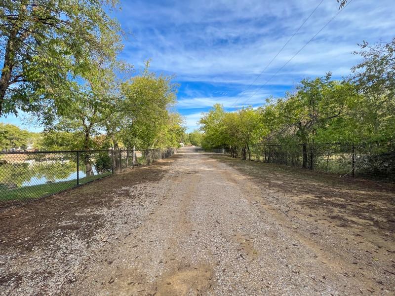14205 Old Denton Road Roanoke, TX 76262 - Photo 9 of 29 a view of a yard with a tree