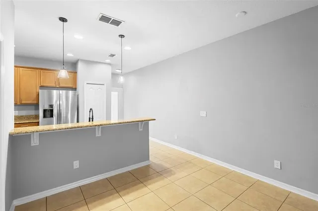 a view of room with a ceiling fan and window