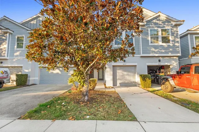 a view of a two chairs in the patio