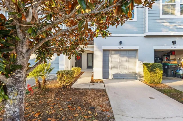 a large kitchen with stainless steel appliances granite countertop a stove a sink and a microwave