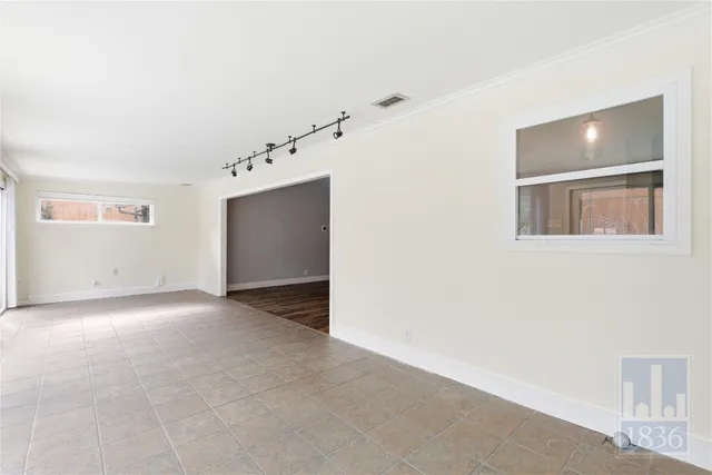 an empty room with a bathroom