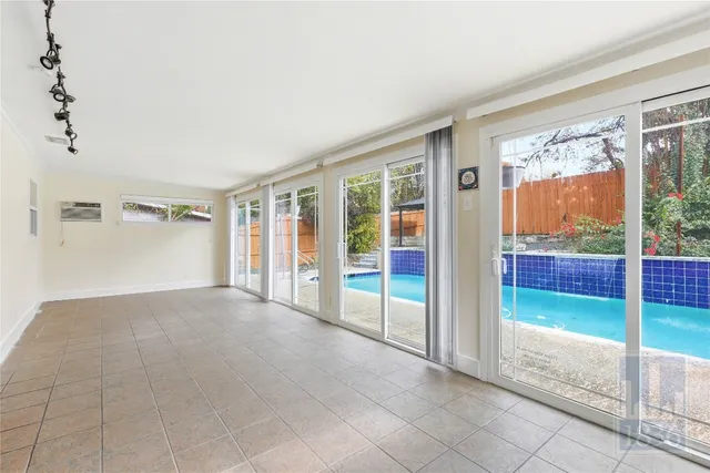 a view of an empty room with windows