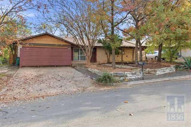 a house with trees in front of it