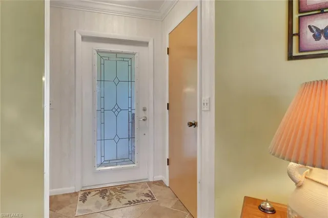 a bathroom with a granite countertop sink a toilet a mirror and bathtub