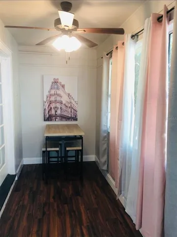 a view of a livingroom with furniture and wooden floor