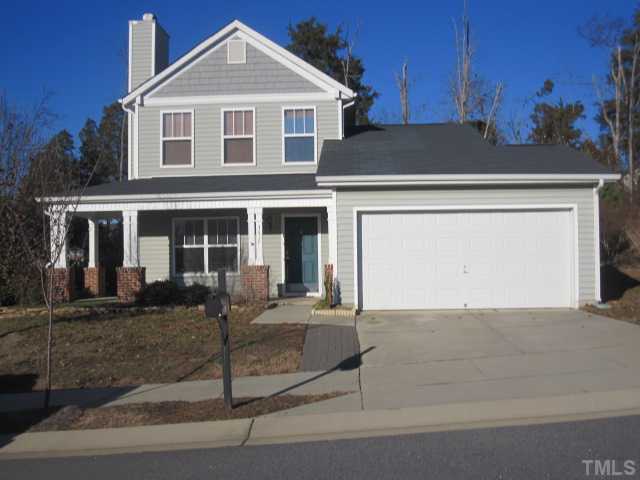 a front view of a house with yard