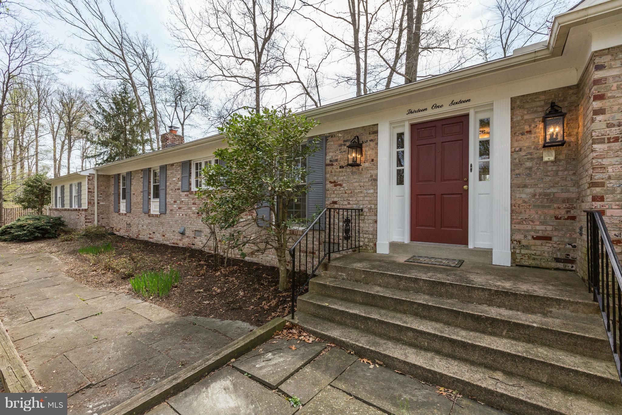 13116 Brandon Way Road Gaithersburg, MD 20878 - Photo 1 of 30 a front view of a house with a yard