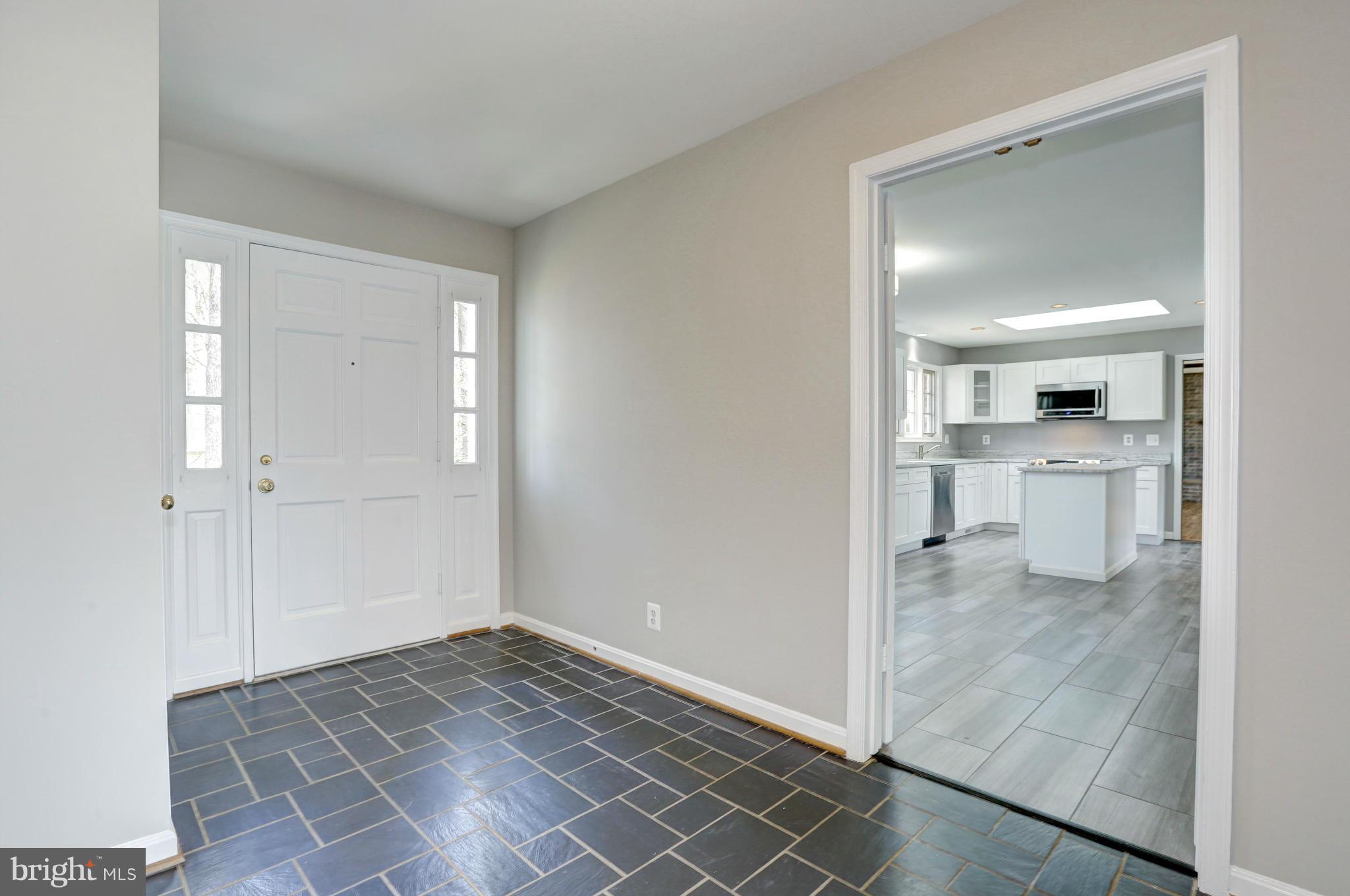 13116 Brandon Way Road Gaithersburg, MD 20878 - Photo 2 of 30 a view of a kitchen with a sink and a refrigerator