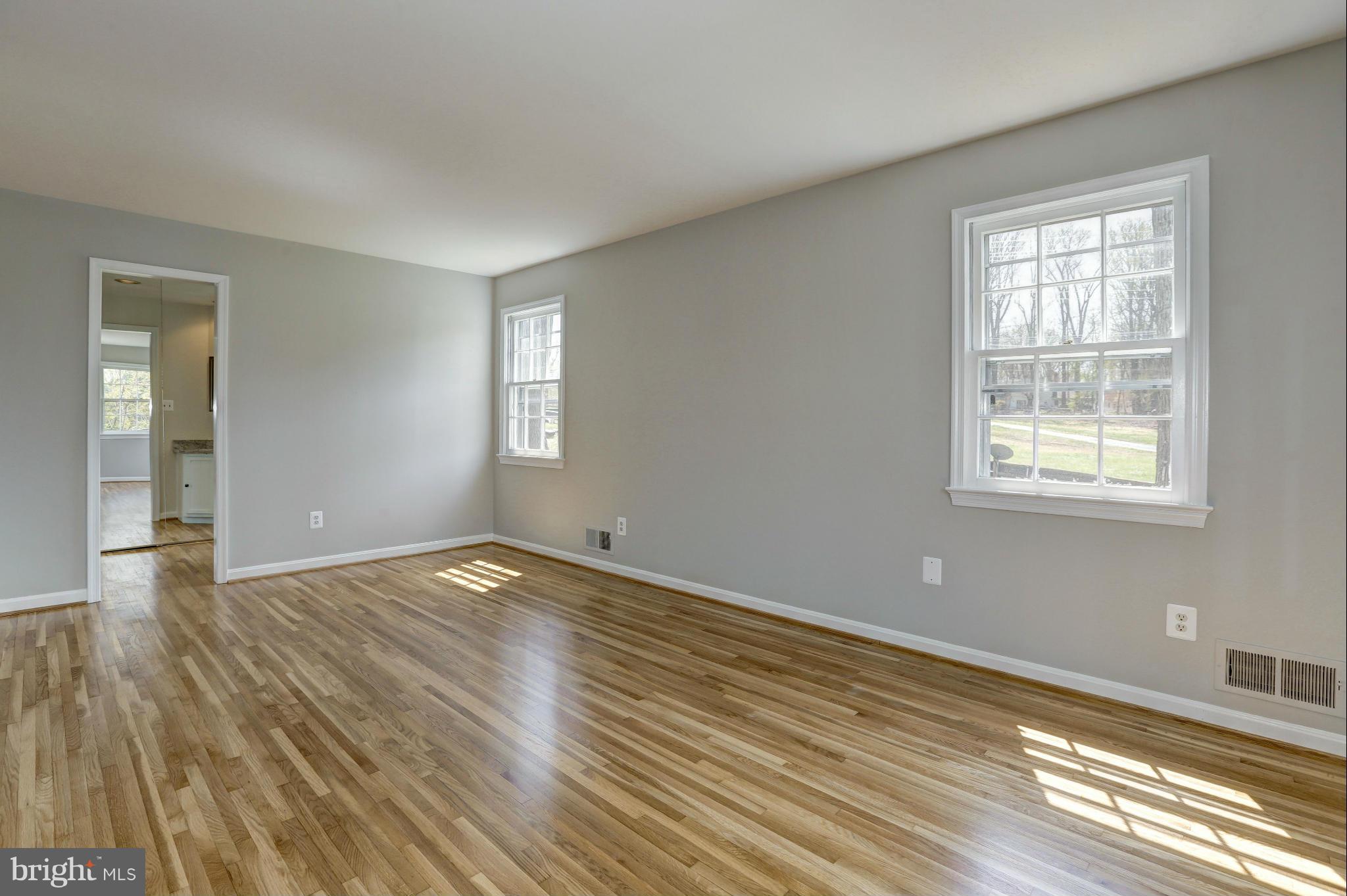 13116 Brandon Way Road Gaithersburg, MD 20878 - Photo 13 of 30 a view of empty room with wooden floor and fan