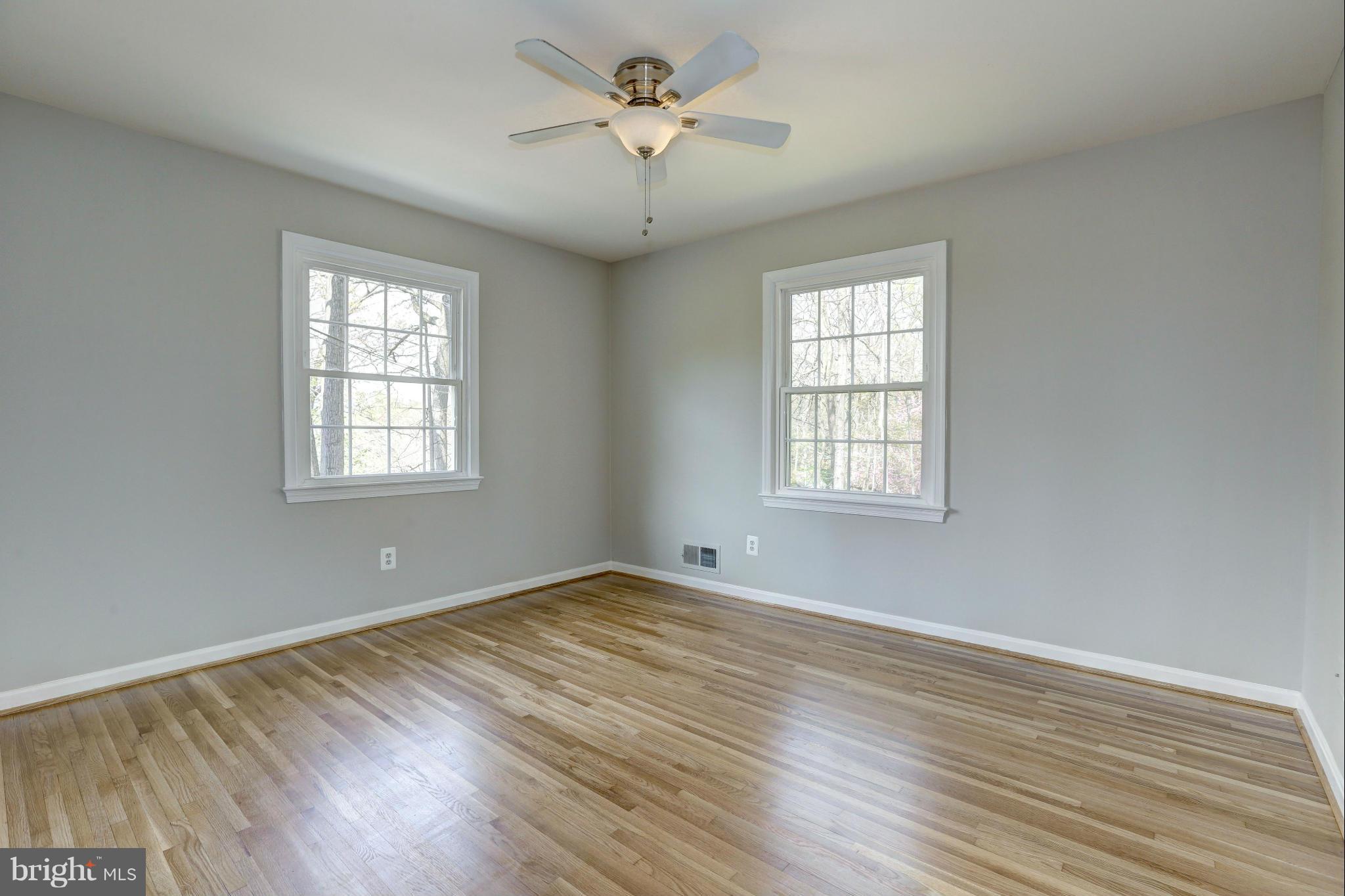 13116 Brandon Way Road Gaithersburg, MD 20878 - Photo 17 of 30 a view of a room with wooden floor and windows