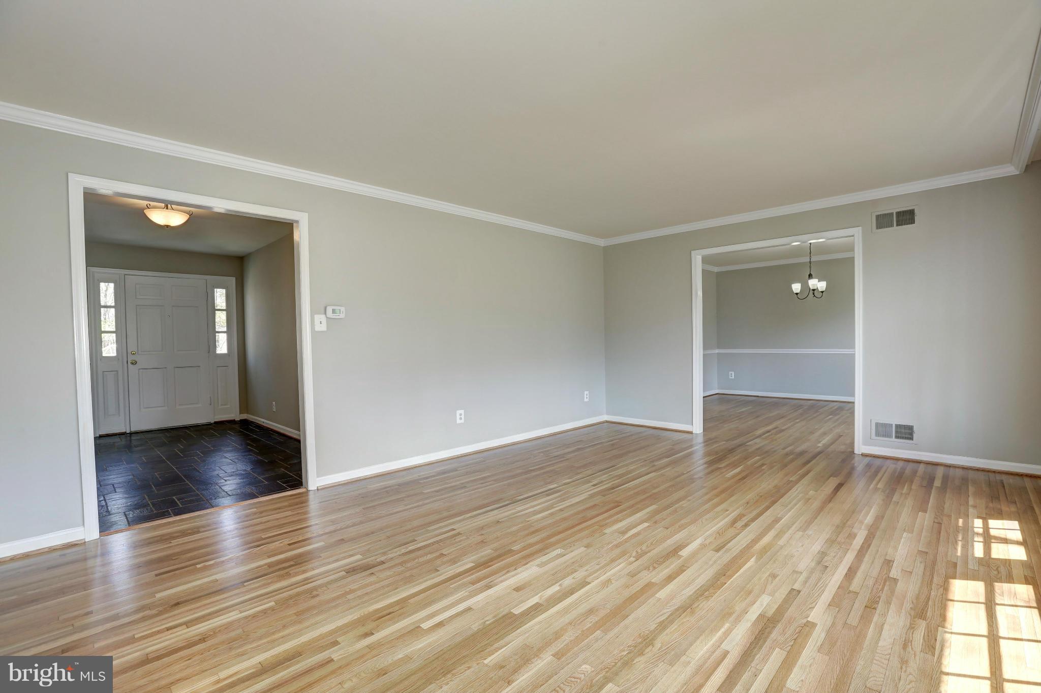 13116 Brandon Way Road Gaithersburg, MD 20878 - Photo 3 of 30 an empty room with wooden floor & windows