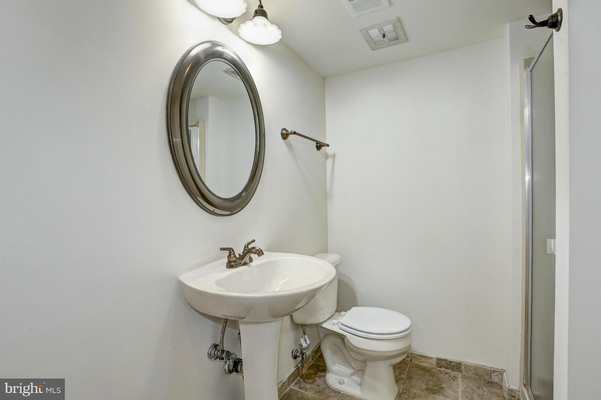 13116 Brandon Way Road Gaithersburg, MD 20878 - Photo 21 of 30 a bathroom with a sink and a mirror