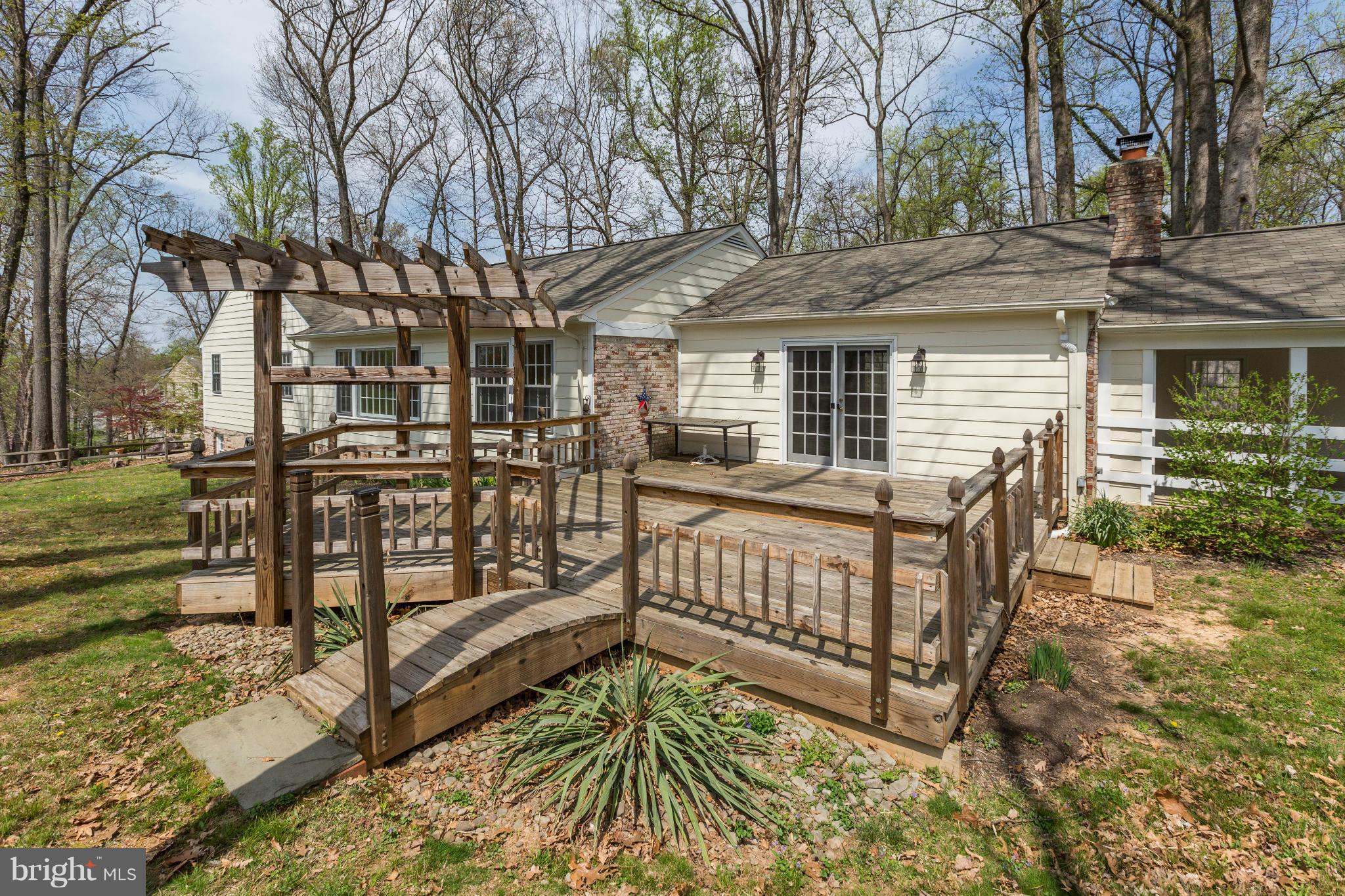 13116 Brandon Way Road Gaithersburg, MD 20878 - Photo 23 of 30 a view of a house with a wooden deck