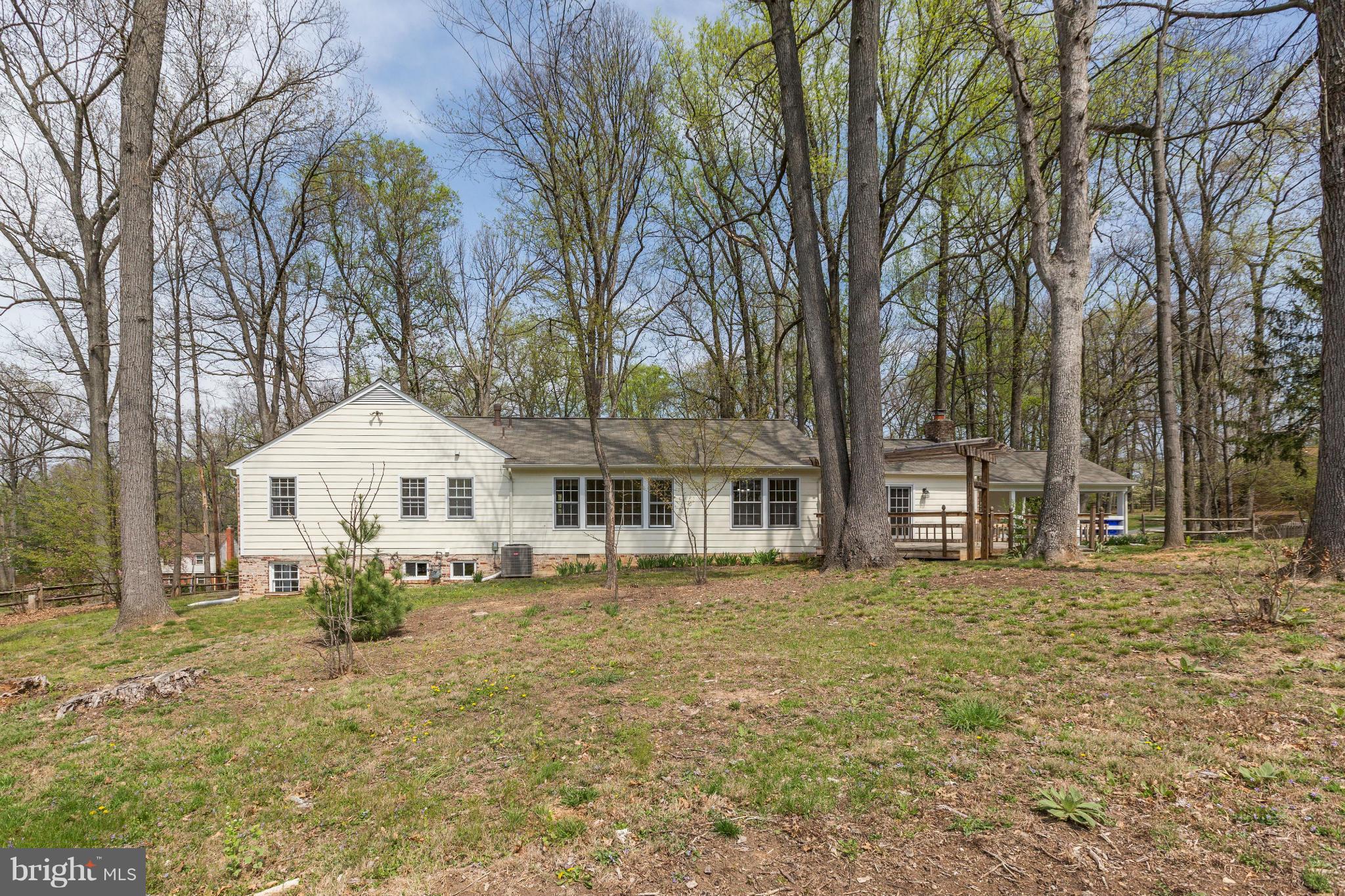 13116 Brandon Way Road Gaithersburg, MD 20878 - Photo 26 of 30 a front view of a house with a garden