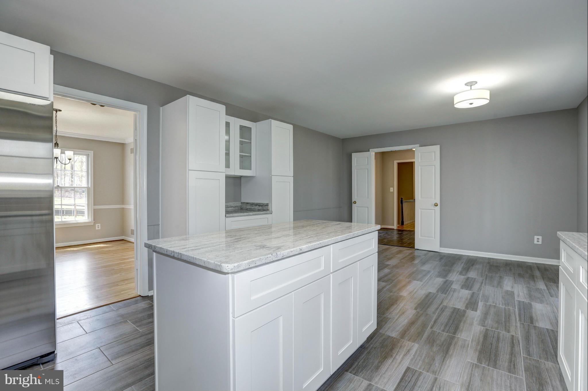 13116 Brandon Way Road Gaithersburg, MD 20878 - Photo 10 of 30 a kitchen with a sink and cabinets