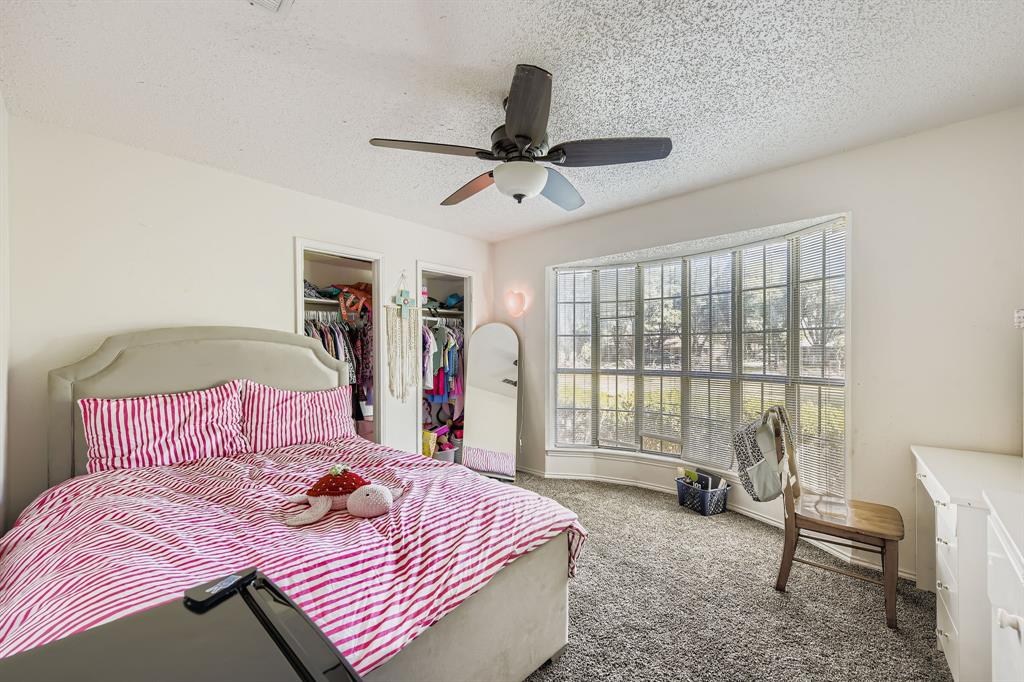 6232 North Ridge Road Fort Worth, TX 76135 - Photo 18 of 29 a bedroom with a bed and a large window