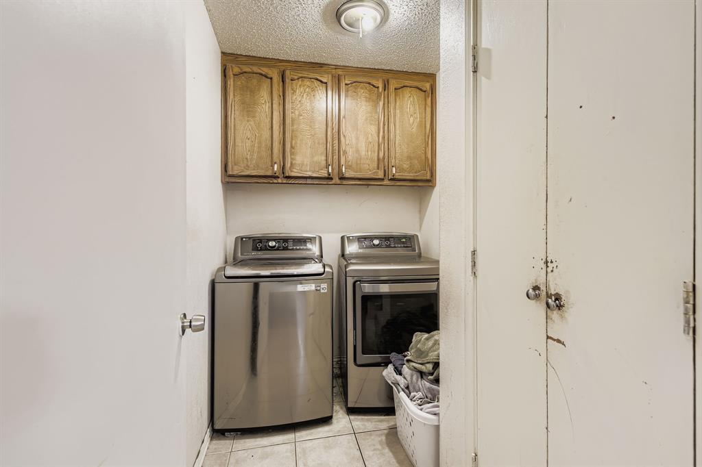 6232 North Ridge Road Fort Worth, TX 76135 - Photo 23 of 29 a utility room with dryer and washer