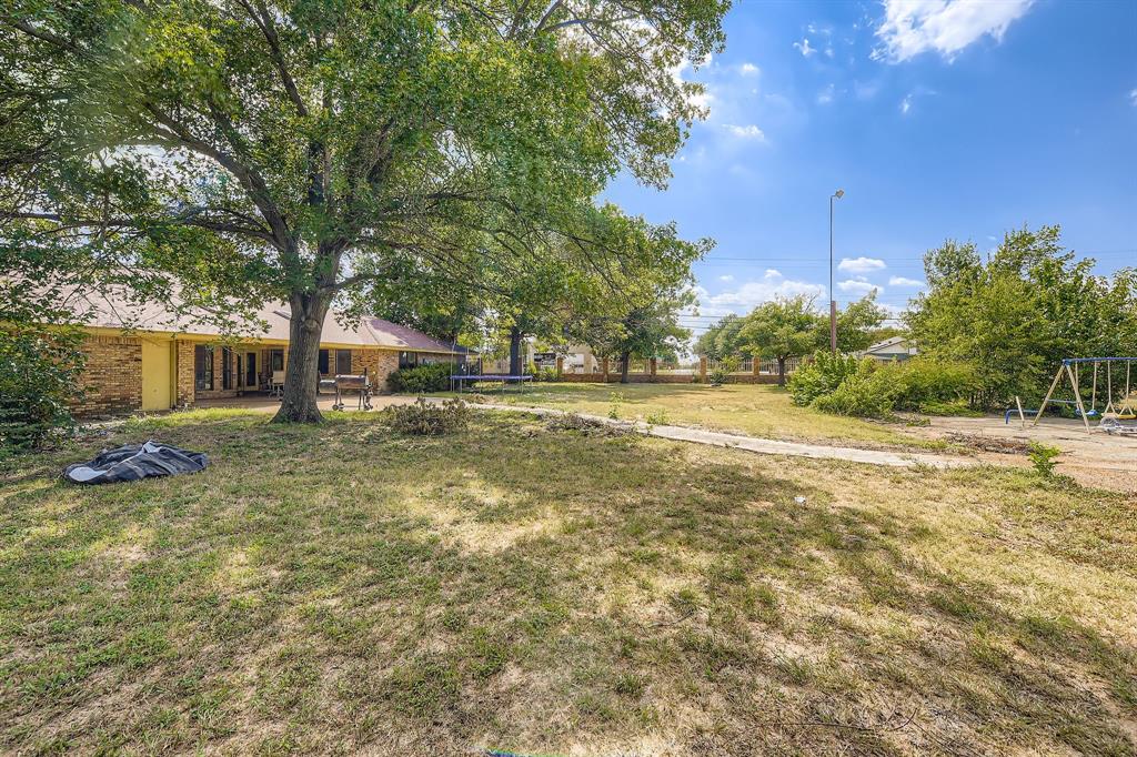 6232 North Ridge Road Fort Worth, TX 76135 - Photo 27 of 29 a view of yard with tree and green space