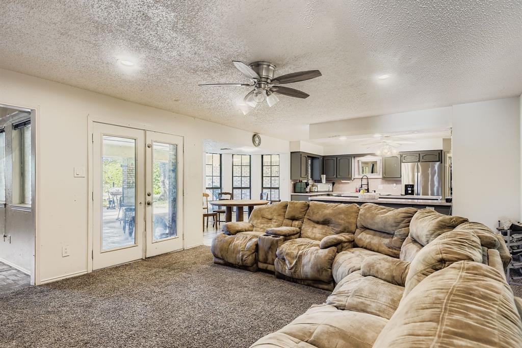 6232 North Ridge Road Fort Worth, TX 76135 - Photo 5 of 29 a living room with furniture and a large window