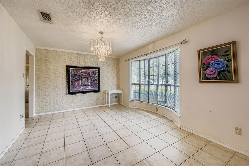 6232 North Ridge Road Fort Worth, TX 76135 - Photo 6 of 29 a view of an empty room with a window