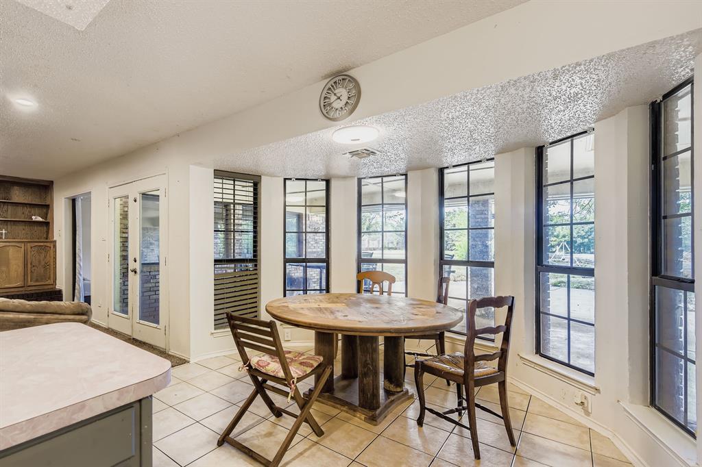 6232 North Ridge Road Fort Worth, TX 76135 - Photo 10 of 29 a view of a dining room with furniture and a large window