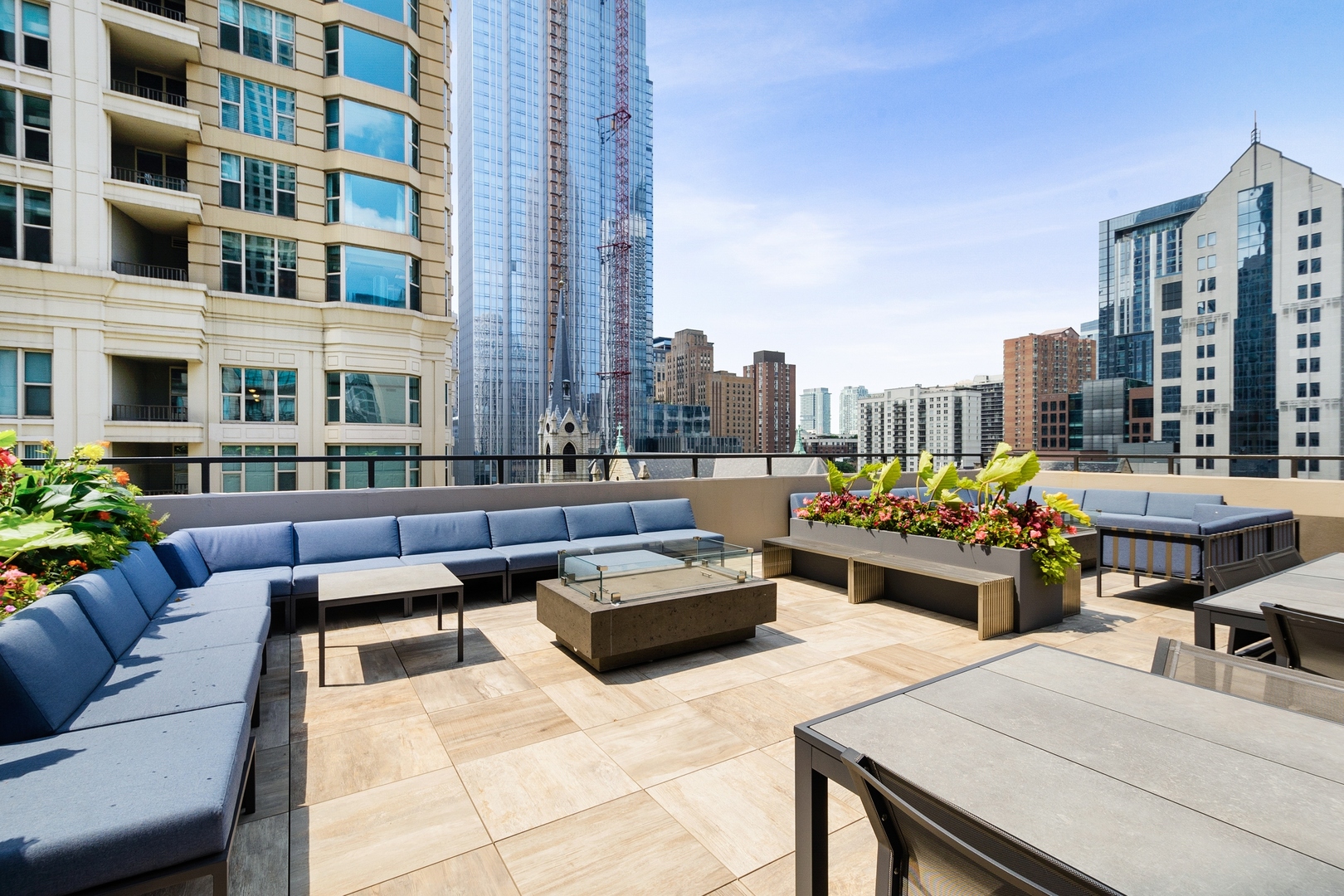 30 East Huron Street, Unit 2003 Chicago, IL 60611 - Photo 17 of 24 a view of a patio with couches and a potted plant on a table