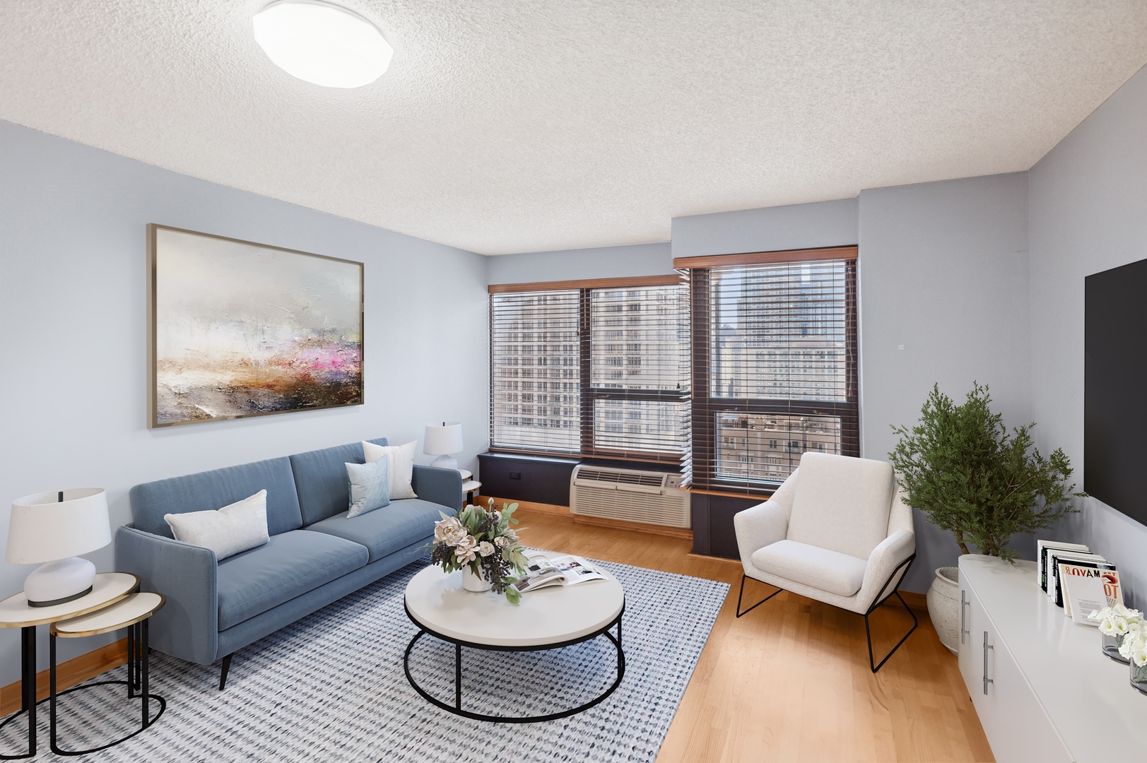 30 East Huron Street, Unit 2003 Chicago, IL 60611 - Photo 3 of 24 a living room with furniture and a large window