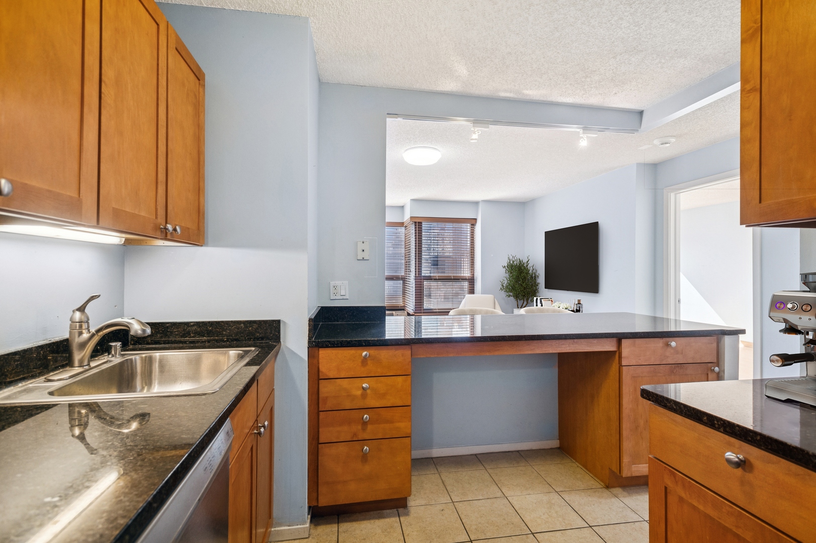 30 East Huron Street, Unit 2003 Chicago, IL 60611 - Photo 7 of 24 a kitchen with a sink and cabinets
