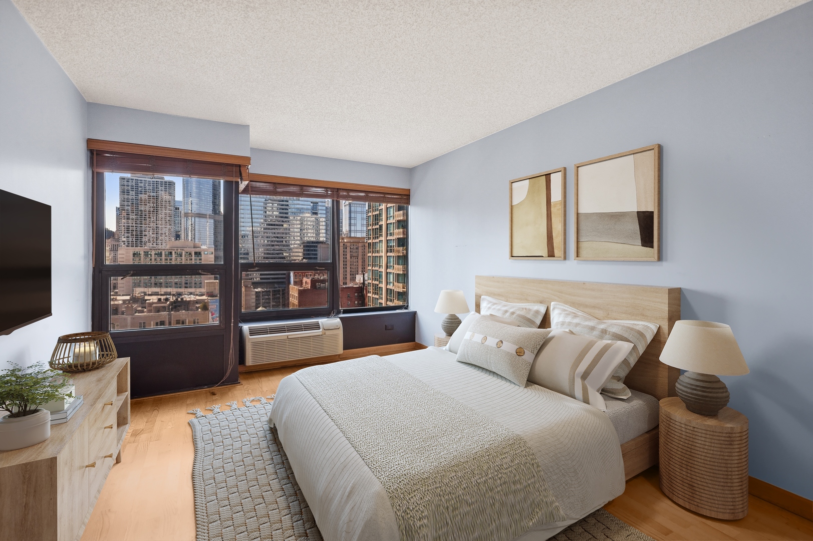 30 East Huron Street, Unit 2003 Chicago, IL 60611 - Photo 8 of 24 a bedroom with a bed and a large window