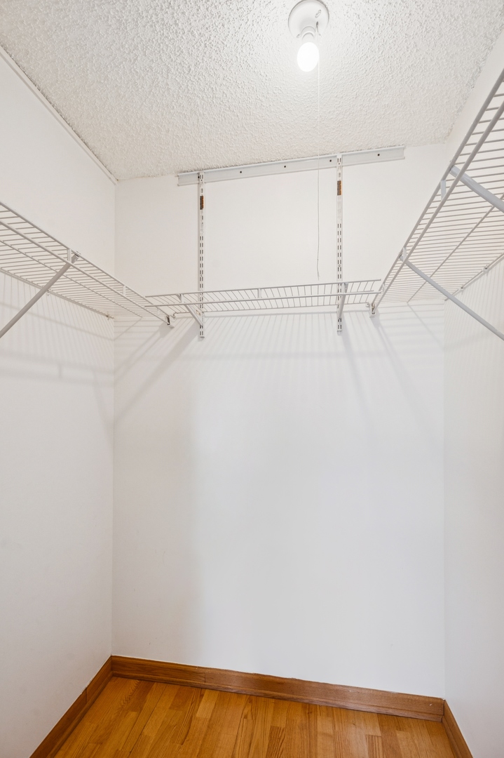 30 East Huron Street, Unit 2003 Chicago, IL 60611 - Photo 10 of 24 a view of a room with racks on the wall