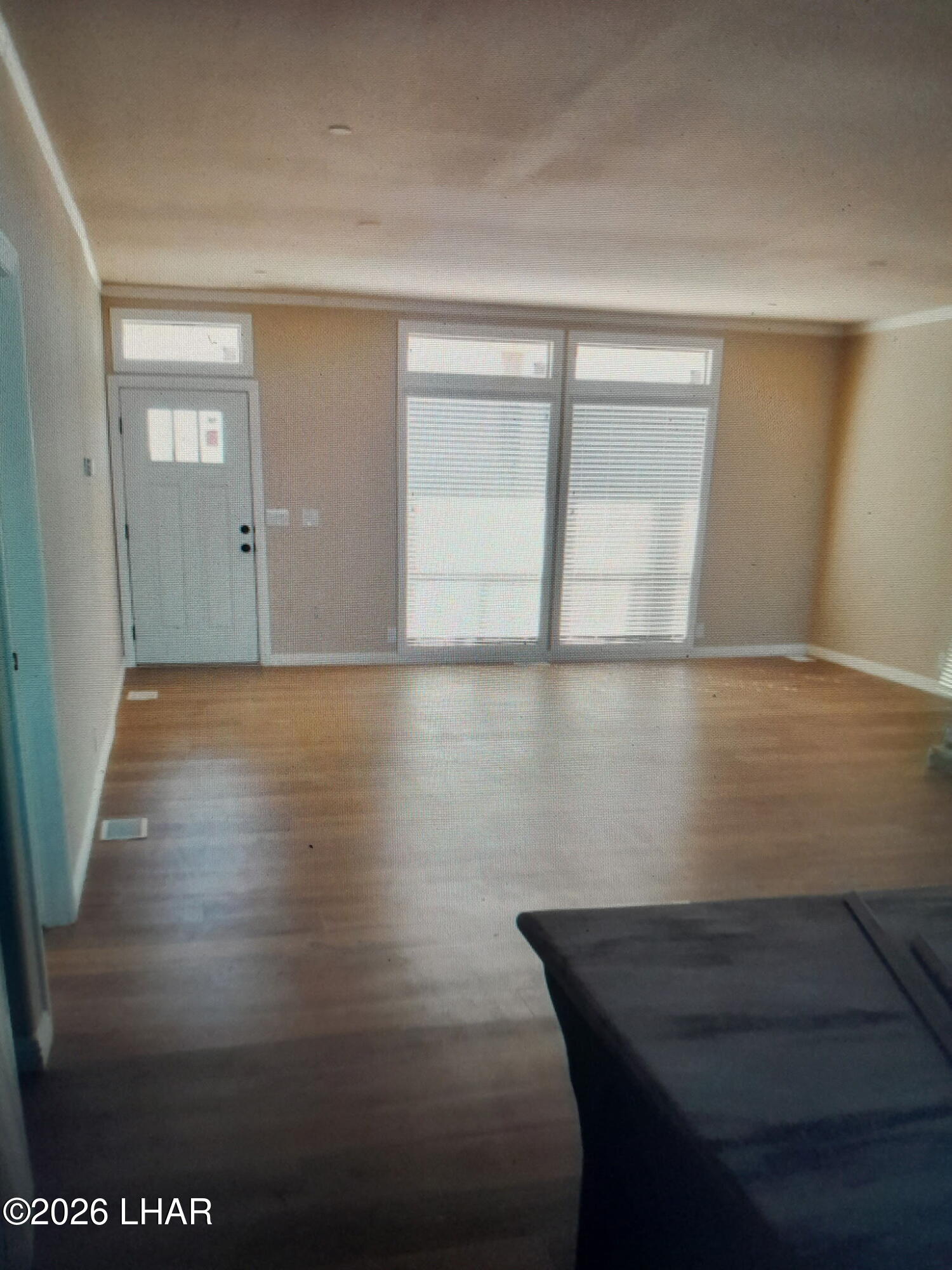 42159 Harms Way Salome, AZ 85348 - Photo 15 of 16 a view of a livingroom with wooden floor and a window