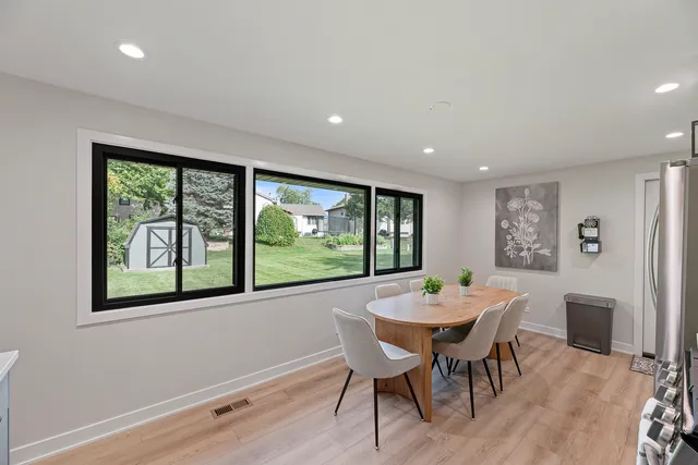 a view of a dining room with furniture window and outside view