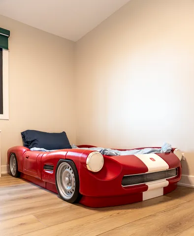 a bedroom with a bed and a table