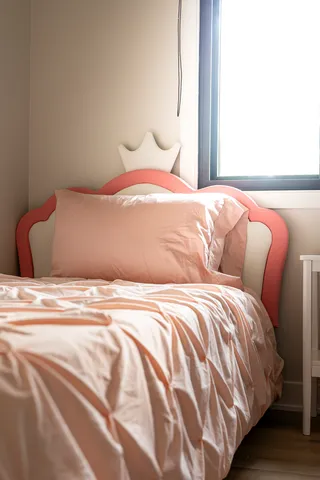 a bedroom with a bed and a night stand