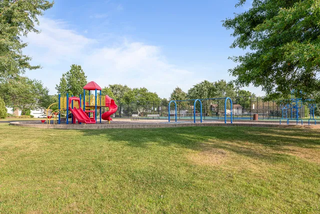 a view of a park with swings and slides