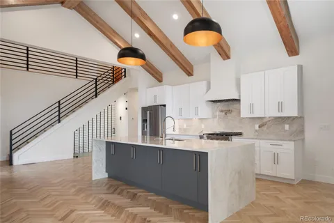a view of an empty room with a fireplace and a window