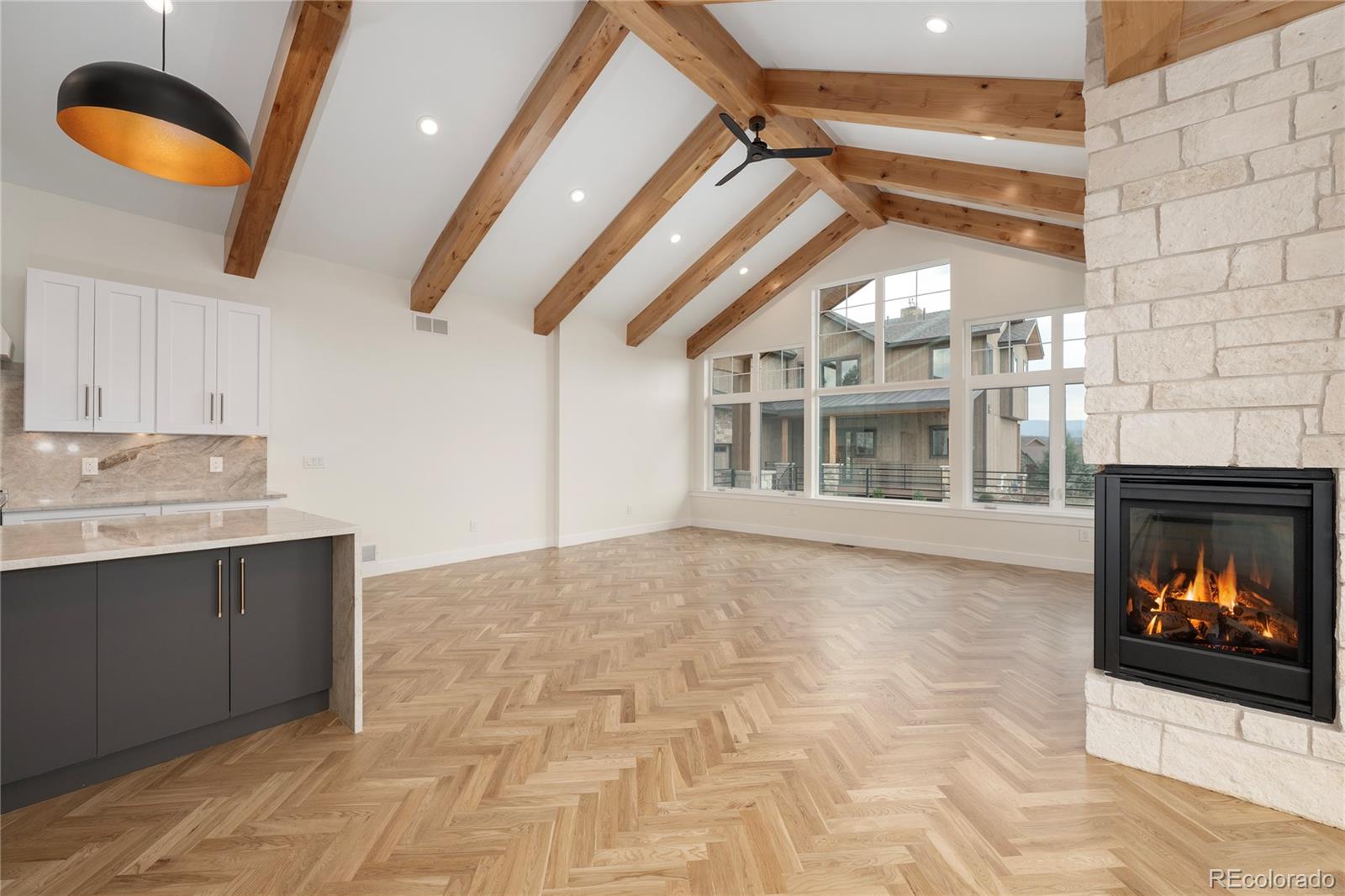 622 Upper Ranch View Drive Granby, CO 80446 - Photo 13 of 50 a view of an empty room with a fireplace and a window