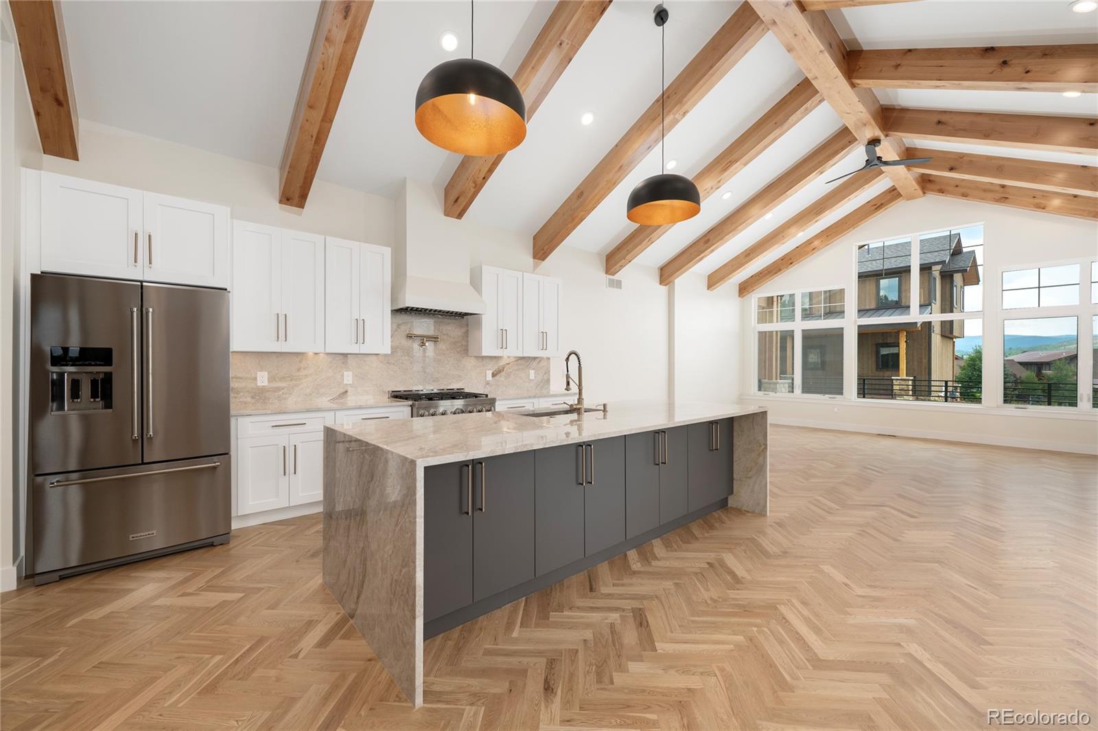 622 Upper Ranch View Drive Granby, CO 80446 - Photo 2 of 50 a kitchen with stainless steel appliances granite countertop a refrigerator a sink dishwasher a stove and a microwave oven