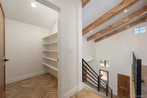 a front view of a house with a garden and yard